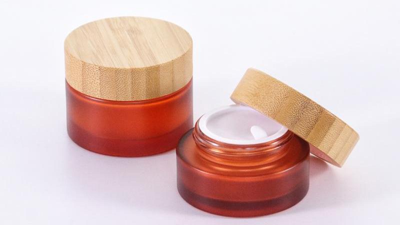 https://www.uzo-pak.com/frosted-glass-cream-bottle-with-wooden-cap.html